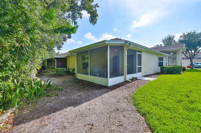 a view of a house with a yard