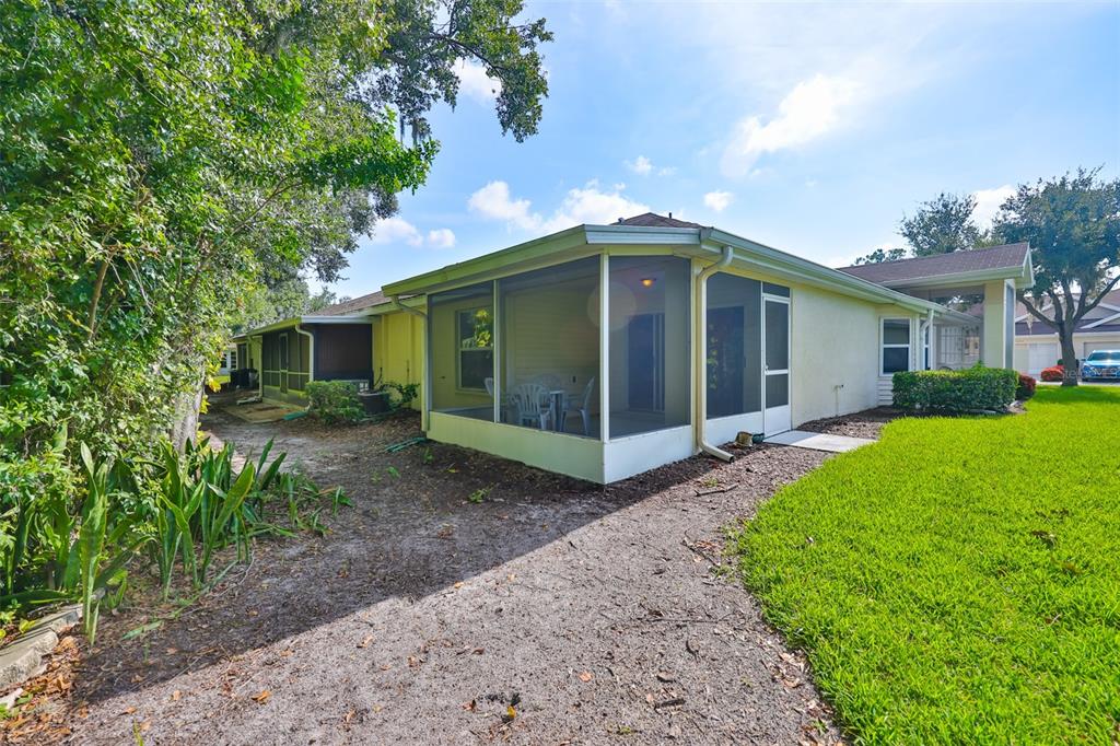 2431 Nantucket Harbor Loop, Unit 61 Sun City Center, FL 33573 - Photo 26 of 37 a view of a house with a yard