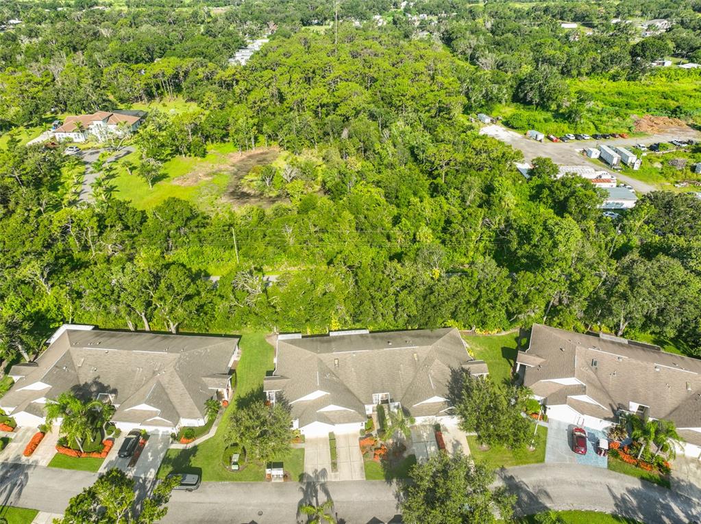 2431 Nantucket Harbor Loop, Unit 61 Sun City Center, FL 33573 - Photo 30 of 37 an aerial view of a house with a yard