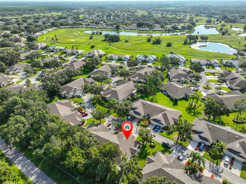 2431 Nantucket Harbor Loop, Unit 61 Sun City Center, FL 33573 - Photo 4 of 37 an aerial view of residential houses with outdoor space