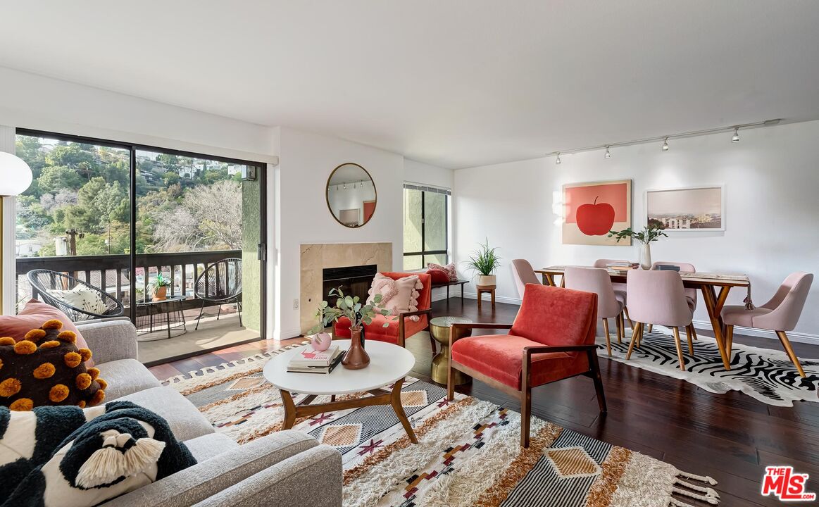 2018 Griffith Park Boulevard, Unit 203 Los Angeles, CA 90039 - Photo 1 of 36 a living room with furniture fireplace and window