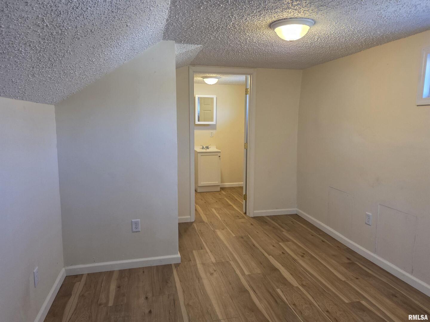 1207 North Market Street Marion, IL 62959 - Photo 19 of 20 wooden floor in an empty room