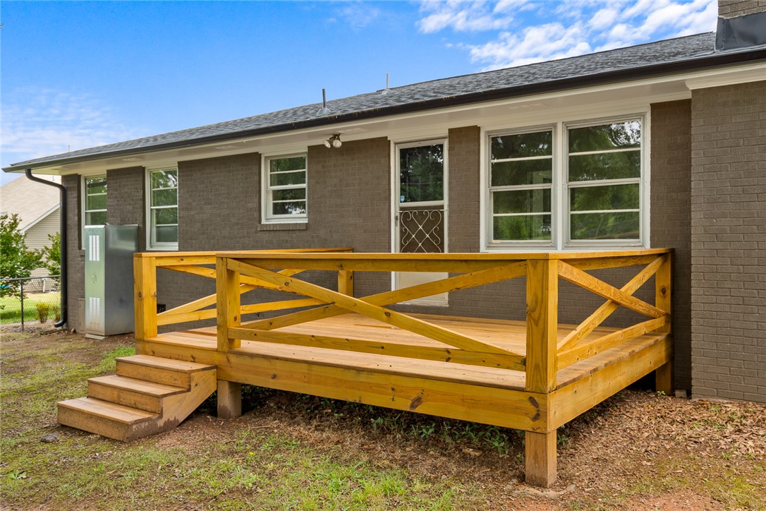 300 Vandiver Road Anderson, SC 29621 - Photo 22 of 30 A newly constructed wood deck extends a comfortable outdoor living space from the home's brick exterior.