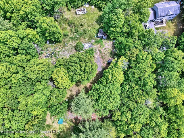 a aerial view of a house with a yard