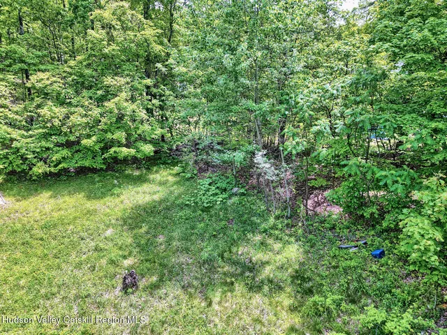 a aerial view of a house with a yard