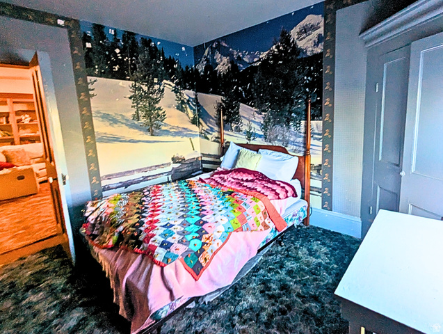 190 North 200 E Street Beaver, UT 84713 - Photo 34 of 40 Bedroom with a feature wall showcasing a winter mountain mural