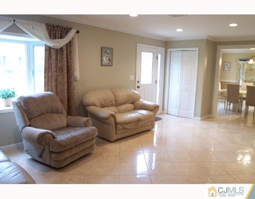4 Altamont Road Edison, NJ 08817 - Photo 3 of 9 a living room with furniture and a window