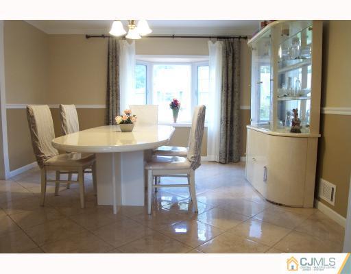 4 Altamont Road Edison, NJ 08817 - Photo 4 of 9 a dining room with furniture and wooden floor