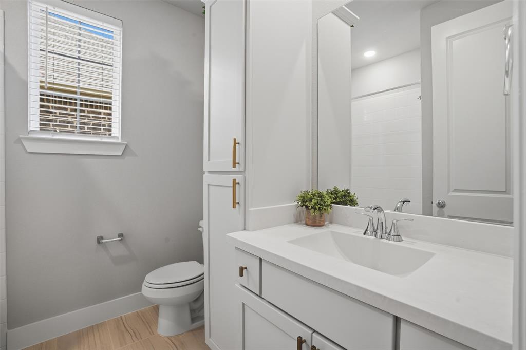 1915 Hillside Court Van Alstyne, TX 75495 - Photo 13 of 36 Guest bathroom between 2 bedrooms
