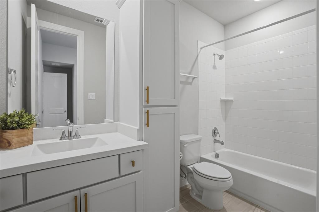 1915 Hillside Court Van Alstyne, TX 75495 - Photo 16 of 36 Guest bathroom en-suite