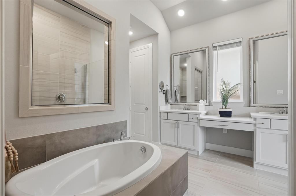 1915 Hillside Court Van Alstyne, TX 75495 - Photo 22 of 36 Garden tub plus a separate shower with his and hers vanities