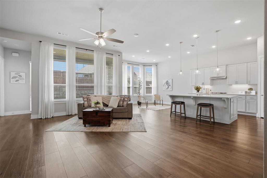 1915 Hillside Court Van Alstyne, TX 75495 - Photo 36 of 36 Open floor plan living and dining area