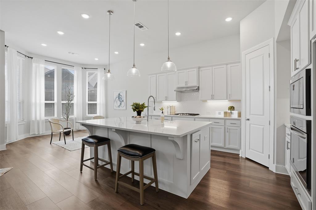 1915 Hillside Court Van Alstyne, TX 75495 - Photo 7 of 36 Kitchen and dining room with bay window