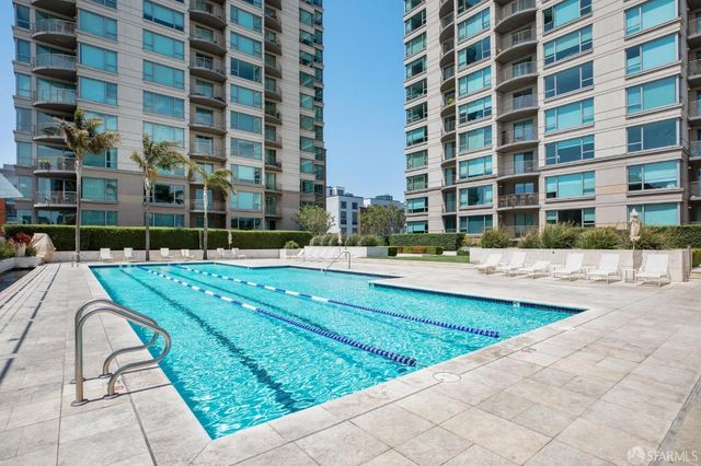 a front view of a house with garden and plants