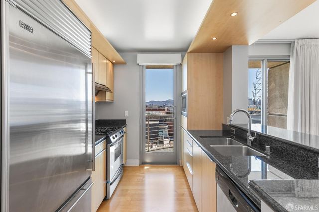 a view of a balcony with a floor to ceiling window and an outdoor space