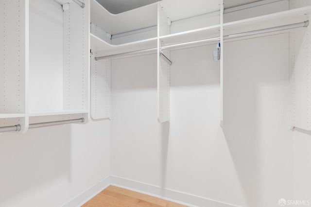 a bathroom with a granite countertop sink a toilet and bathtub