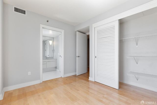 a bathroom with a sink vanity toilet and shower