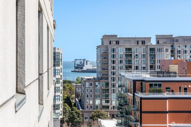 a view of city with tall buildings