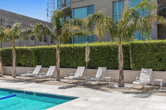 a view of a swimming pool with a lounge chairs