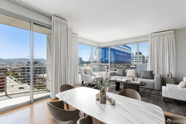 a view of a livingroom with a wooden floor and a window