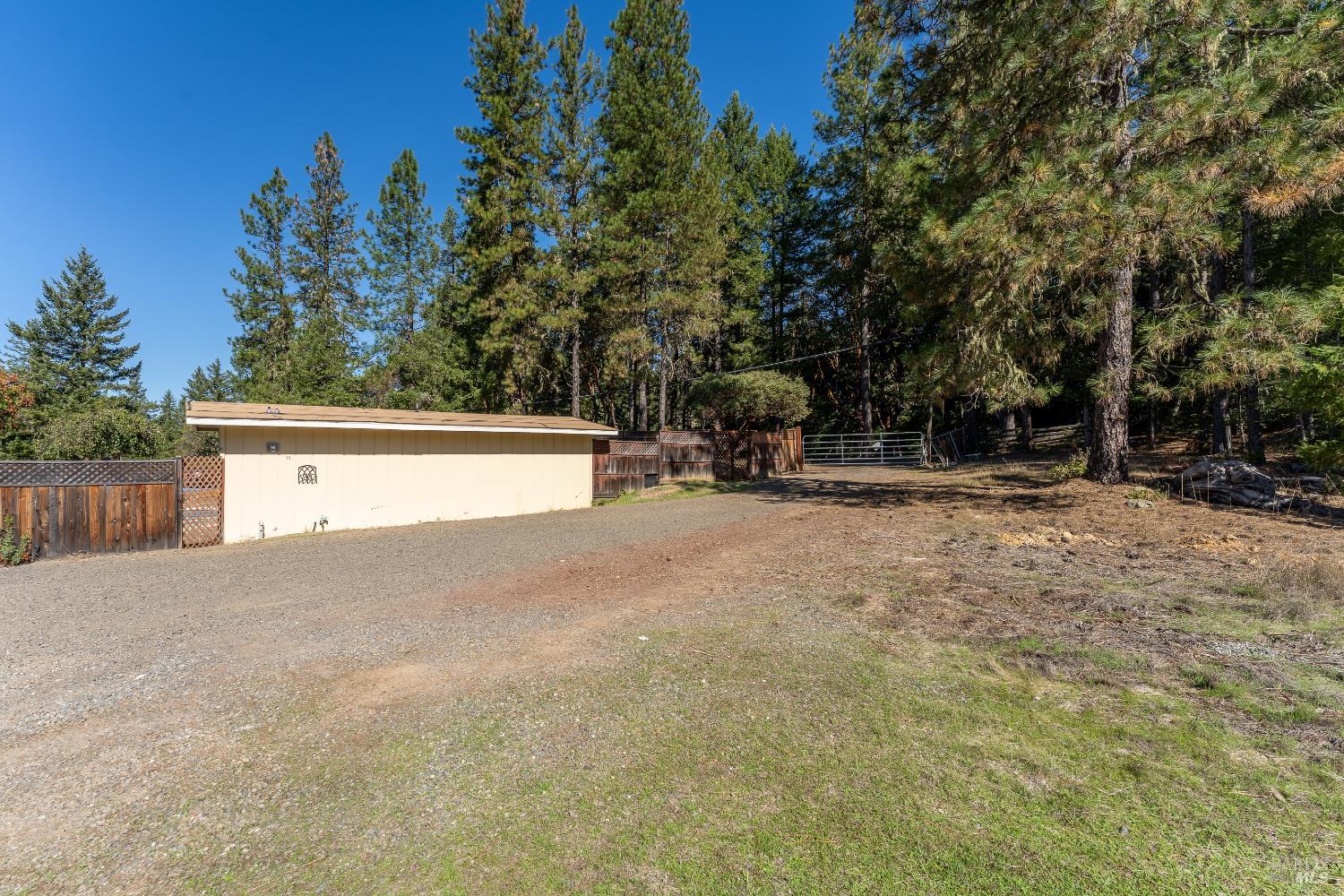 3651 Ridgewood Road Willits, CA 95490 - Photo 38 of 46 Third gated entry on property takes you to a large parking area with carport access.