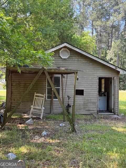4664 Highway 37 Moultrie, GA 31768 - Photo 4 of 7 a view of a house with a yard and wooden fence