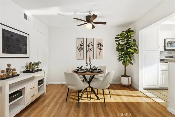 a view of a dining room with furniture window and wooden floor