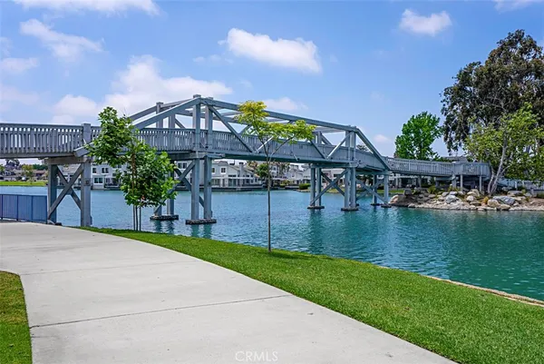 a view of a lake with houses in the back