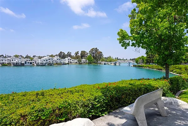 a view of a patio with a table and chairs under an umbrella