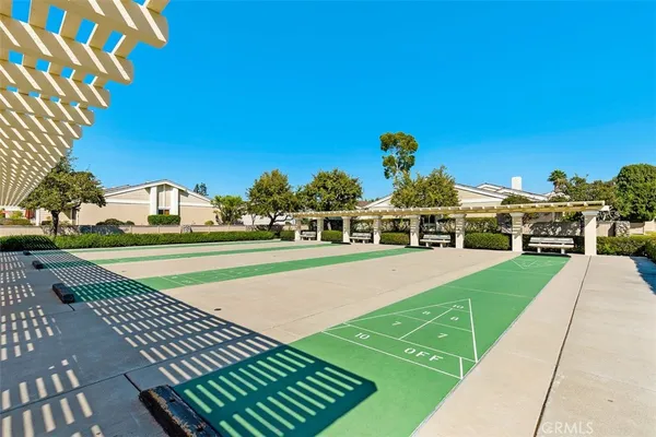 a view of a house with a yard and sitting area