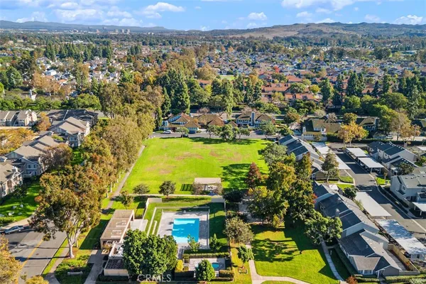 an aerial view of residential houses with outdoor space