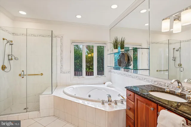 a bathroom with a tub sink and mirror