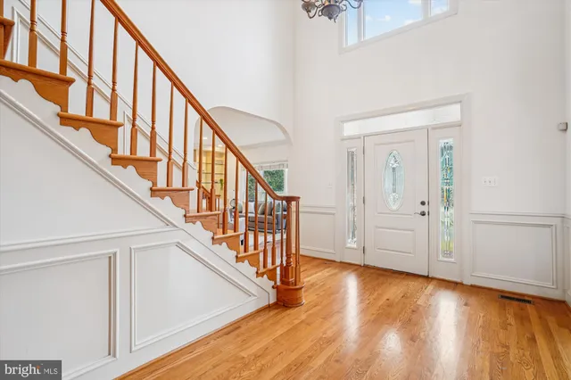 a view of an entryway with wooden floor