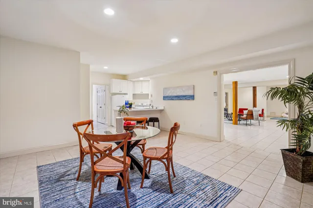 a view of a dining room with furniture and a rug
