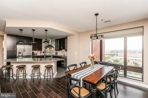 a bathroom with a toilet a sink a mirror and shower