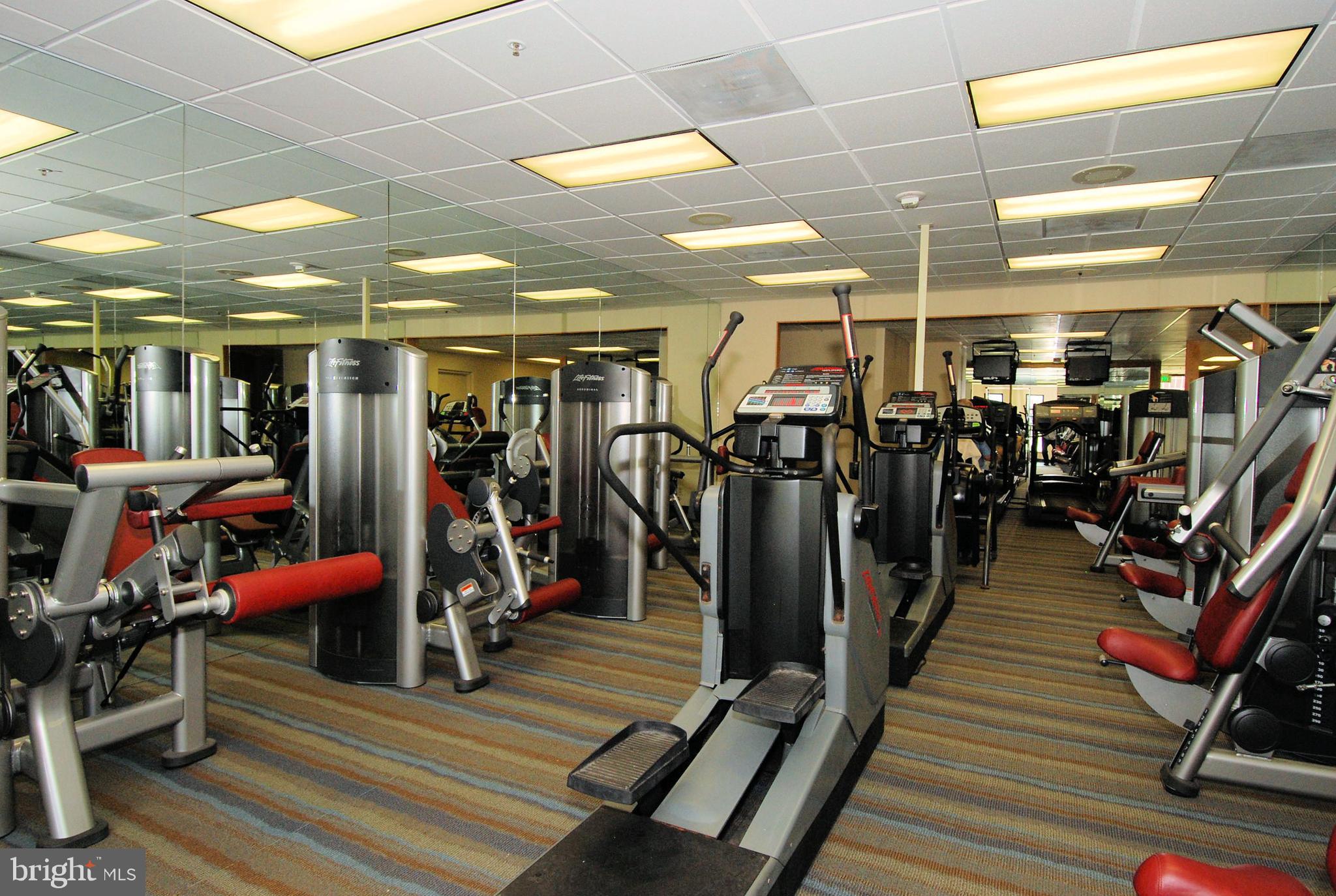 10 East Lee Street, Unit 1209 Baltimore, MD 21202 - Photo 28 of 38 a view of a room with gym equipment