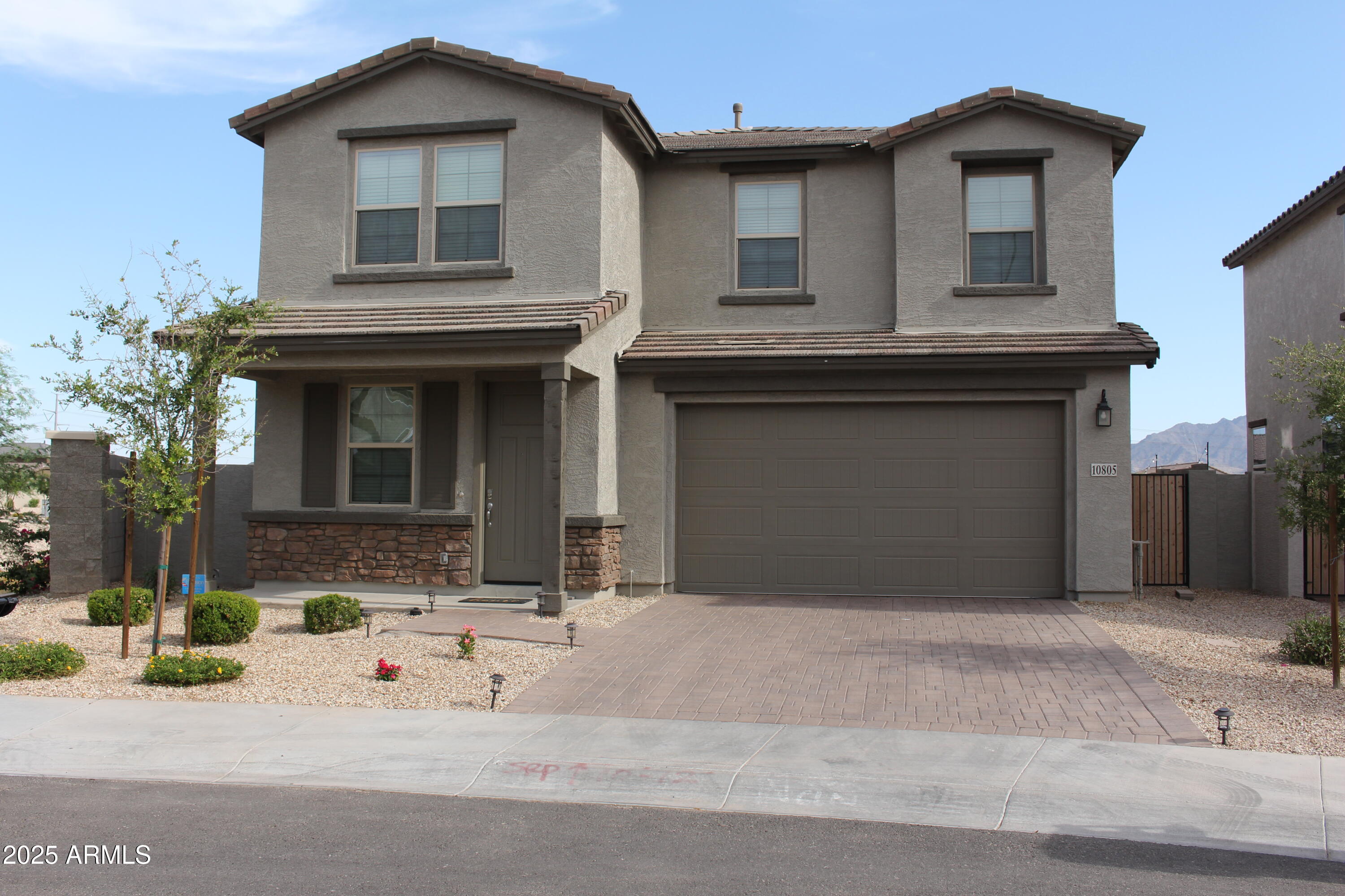 10805 West Levi Drive Tolleson, AZ 85353 - Photo 1 of 21 a front view of a house with yard