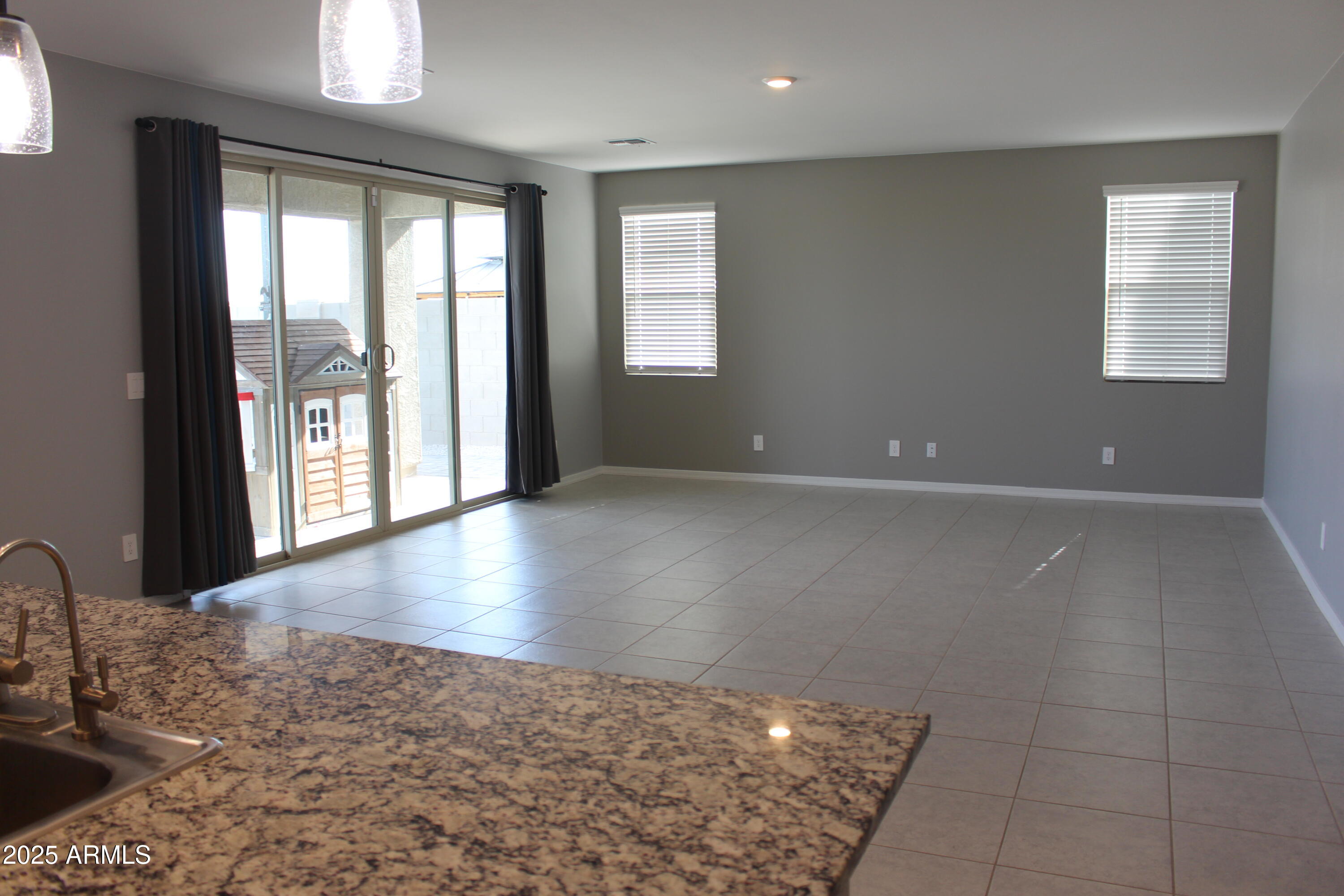 10805 West Levi Drive Tolleson, AZ 85353 - Photo 6 of 21 a view of a livingroom with a hard wood floor