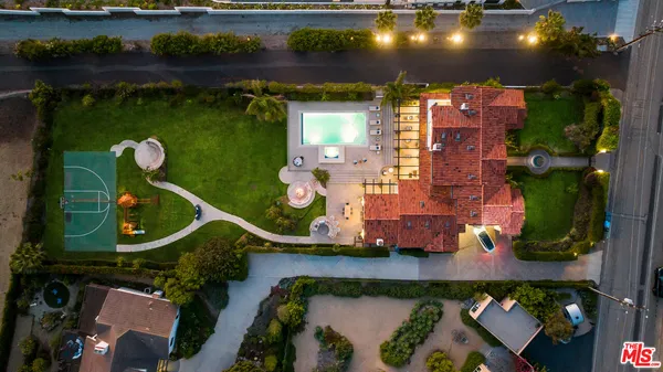 an aerial view of houses with yard