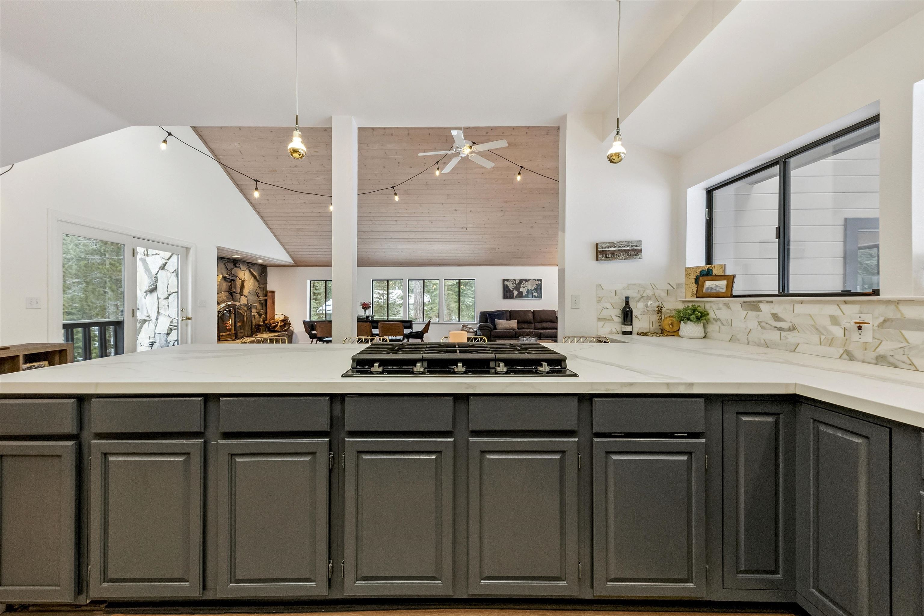 1141 Regency Way Tahoe Vista, CA 96148 - Photo 14 of 28 a kitchen with stainless steel appliances granite countertop a sink and cabinets