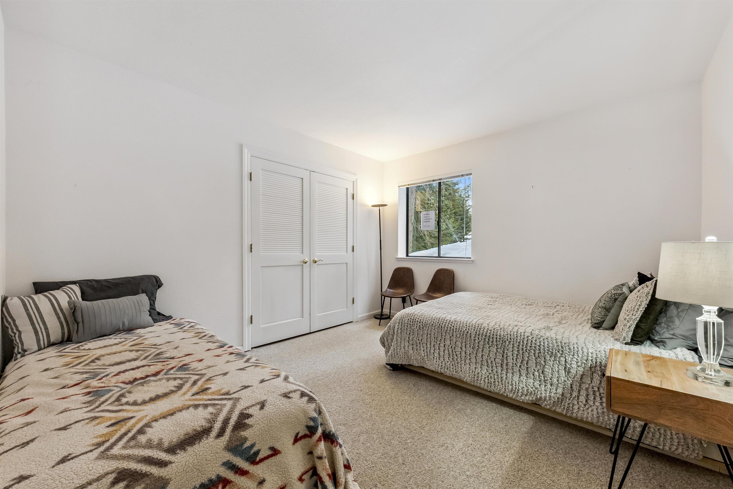1141 Regency Way Tahoe Vista, CA 96148 - Photo 23 of 28 a bedroom with a bed and a window