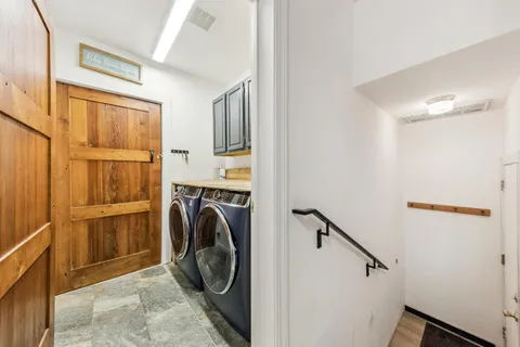 a view of a storage & utility room with washer and dryer