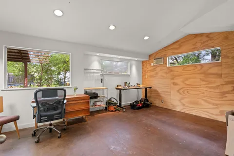 a patio with table and chairs