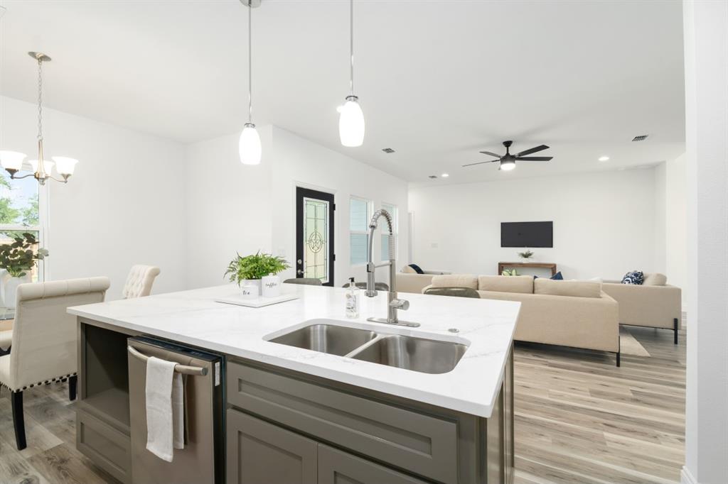 228 Windjammer Road Gun Barrel City, TX 75156 - Photo 8 of 19 a kitchen with a sink a counter space and living room view