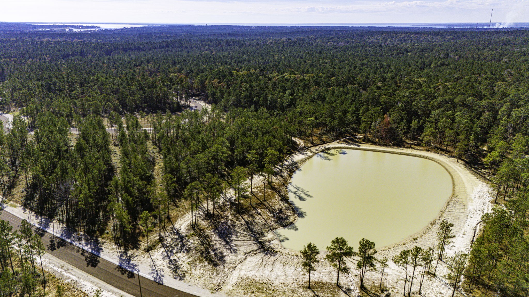 26 King Ranch Rd Road South Onalaska, TX 77360 - Photo 6 of 16 a view of a swimming pool and trees