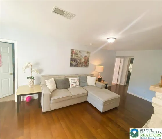 a bathroom with a double vanity sink mirror and toilet