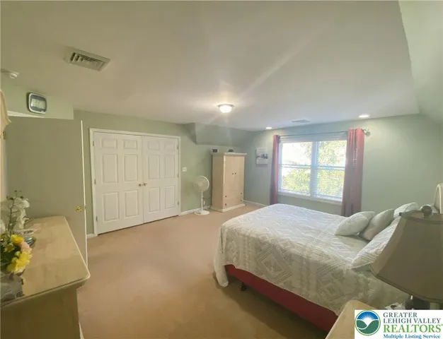 a bathroom with a shower and a sink