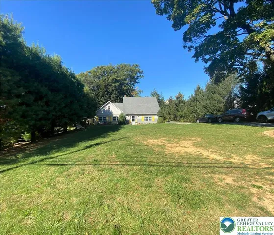 a view of a swimming pool with a yard