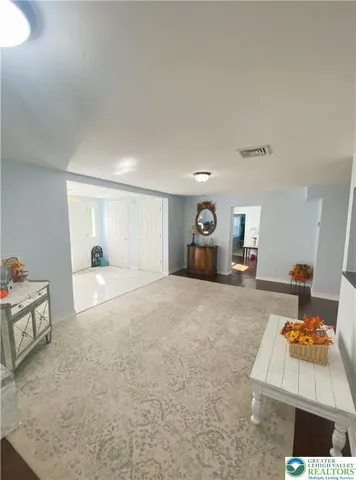 a living room with furniture and a table