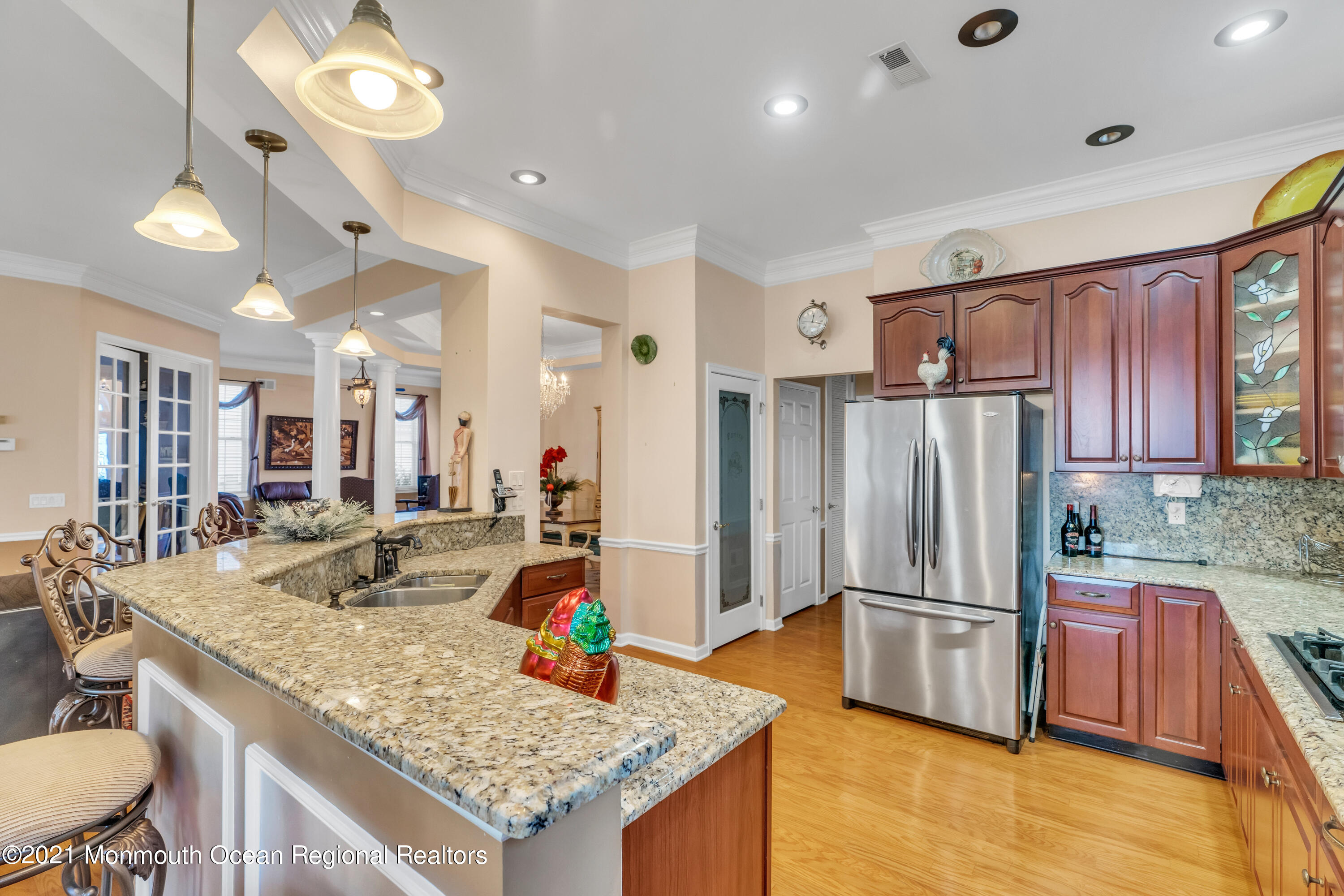 32 Crooked Stick Road Jackson, NJ 08527 - Photo 15 of 33 a kitchen with stainless steel appliances granite countertop a sink refrigerator and cabinets